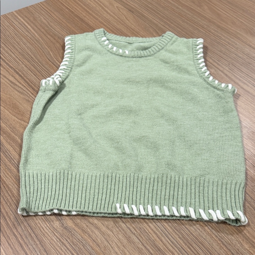 New without tags light green sweater vest with white accents size small